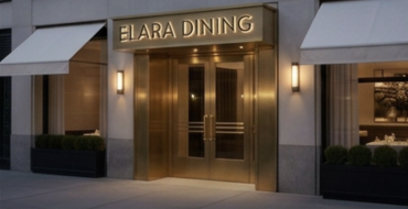 Custom illuminated restaurant signage above an upscale dining entrance